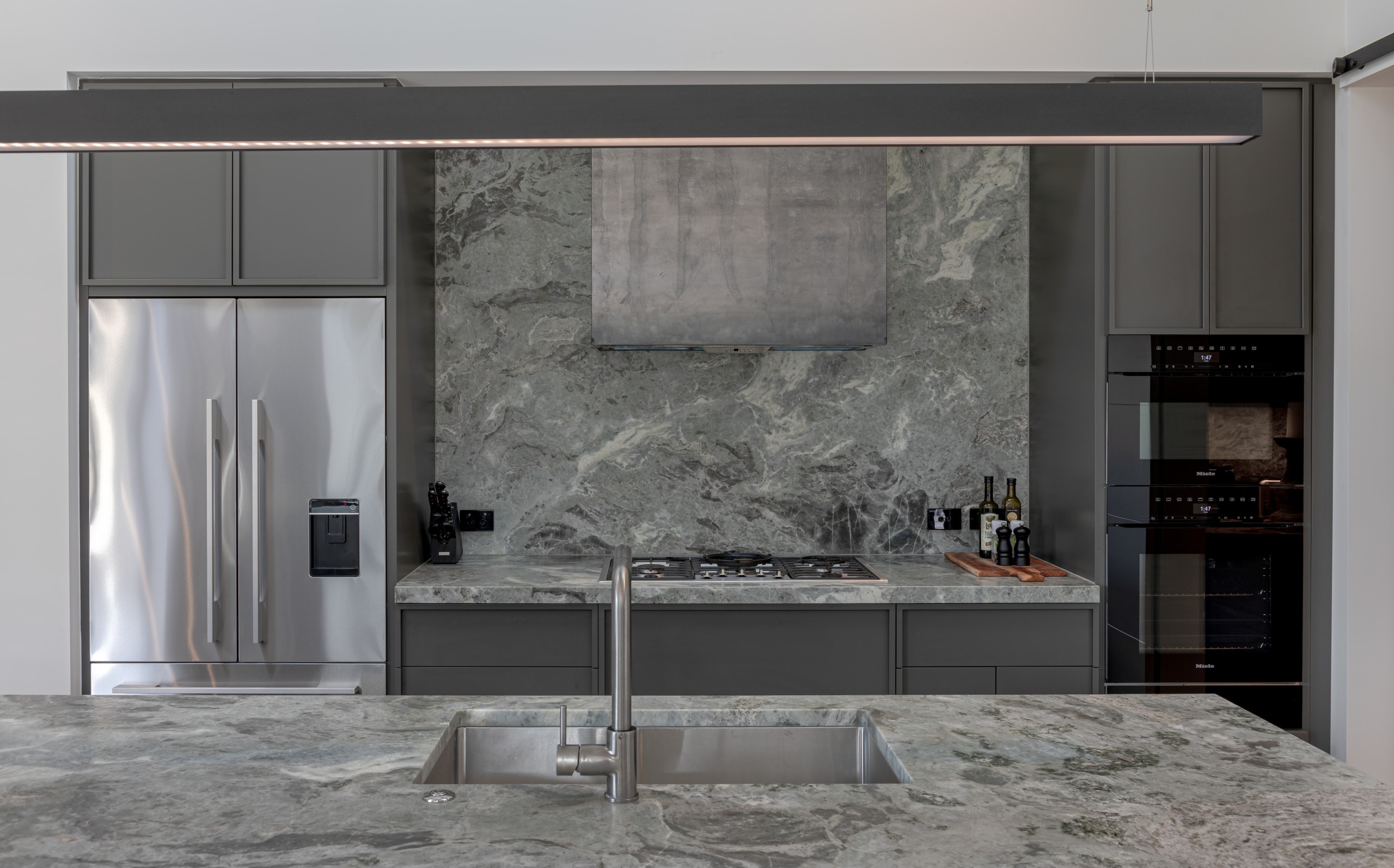 Fantasy white Granite Kitchen island close up and splashback front on. Millbrook Queenstown.