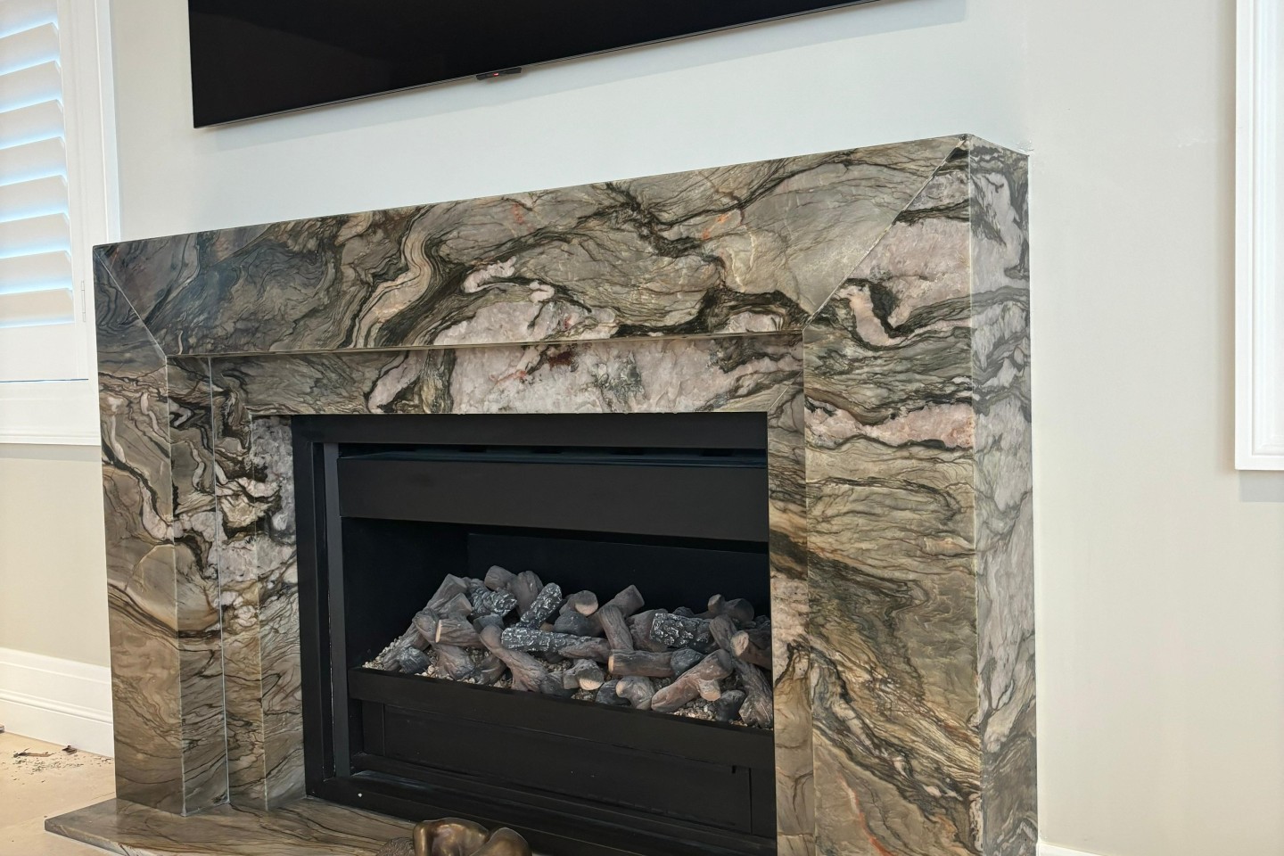 Blue Tempest quartzite fire surround and hearth