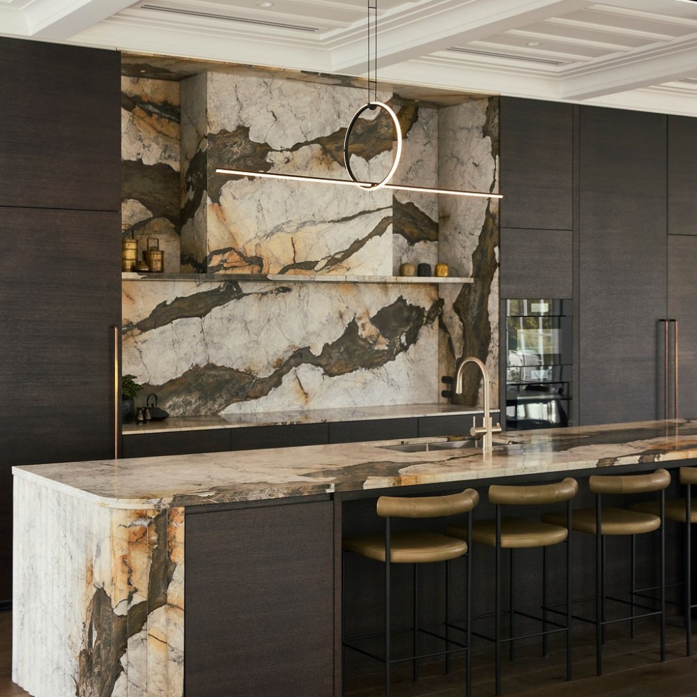 Montenegro marble ki9tchen island with curved multifaceted waterfall end and bullnose edge detailing