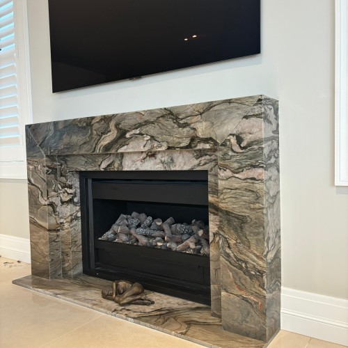 Blue Tempest quartzite fire surround and hearth
