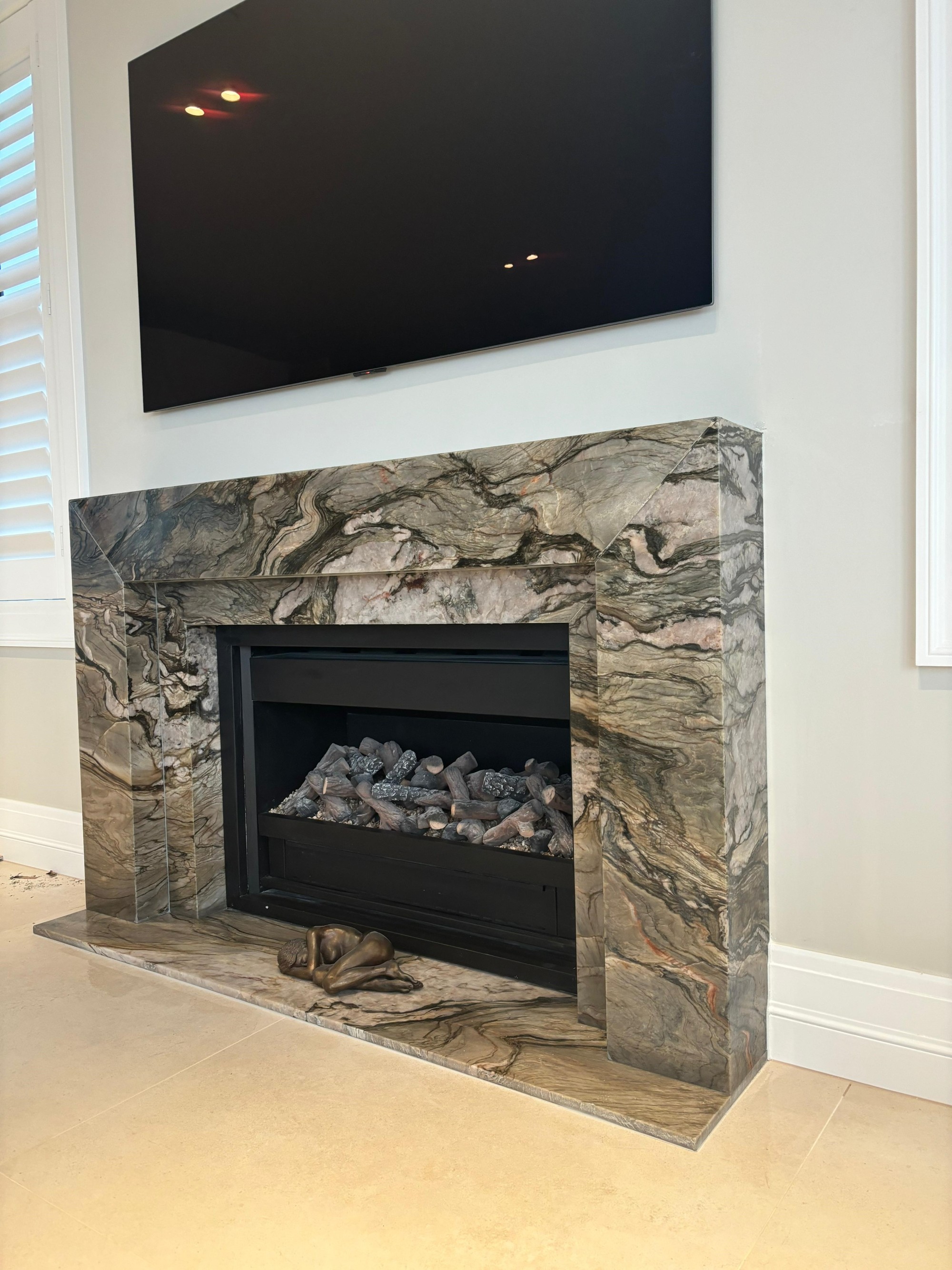 Blue Tempest quartzite fire surround and hearth