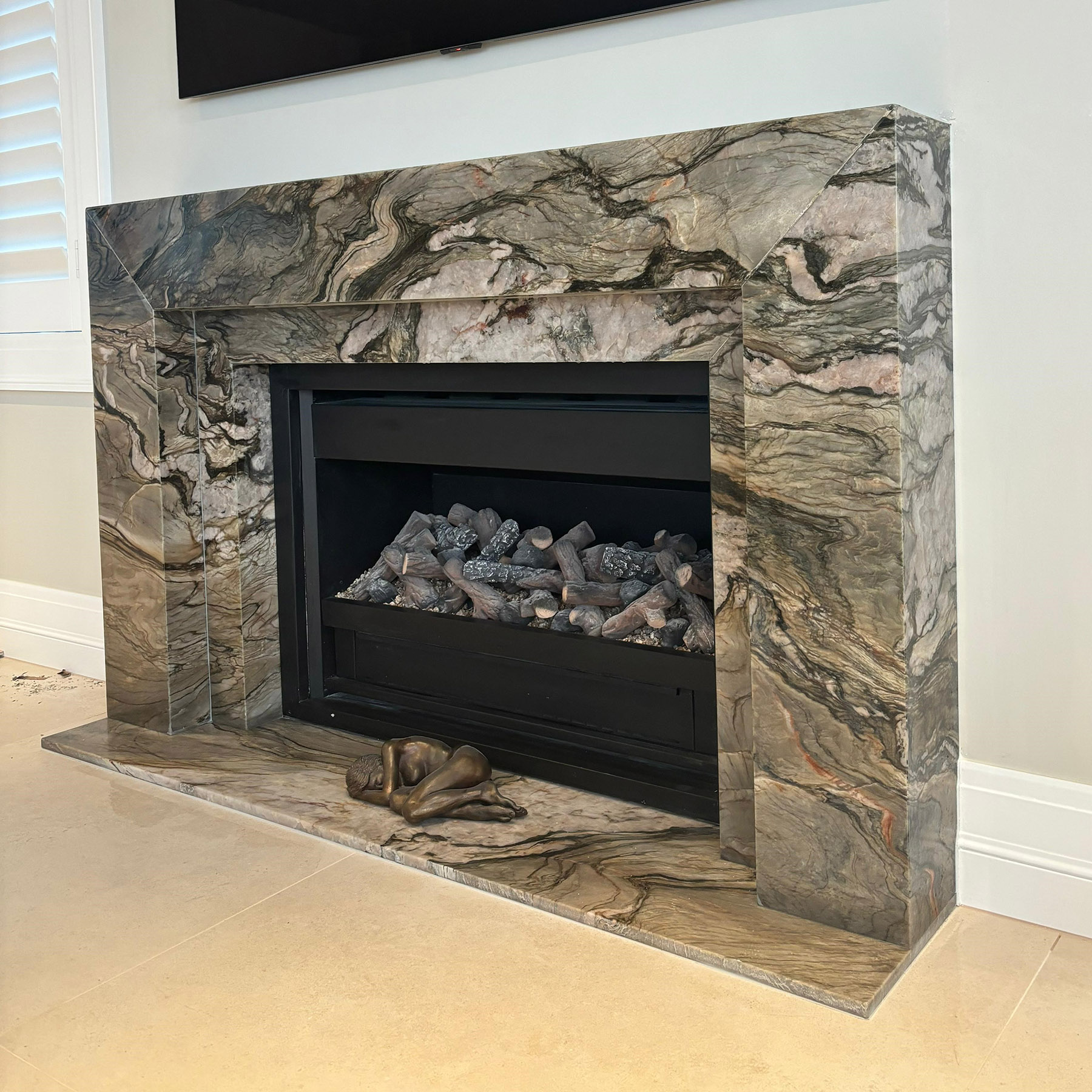 Blue Tempest quartzite fire surround hearth