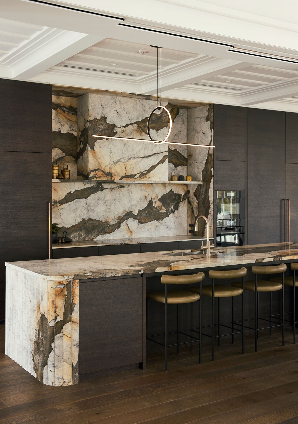 Montenegro marble kitchen island with curved fluted waterfall end and bullnose edge detailing