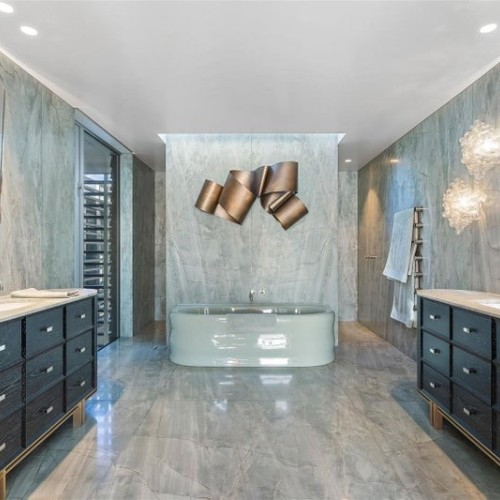 Mystique Green quartzite walls floors shower bathroom vanity tops