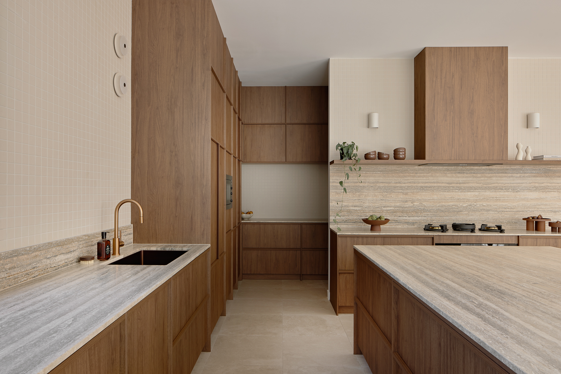 Silver travertine benchtops and splashback